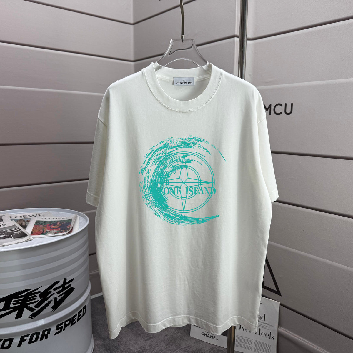Stone Island Spring–Summer 2026 T-Shirt — 320gsm Washed Distressed Cotton, Teal Swirl Brushstroke Compass Rose Print