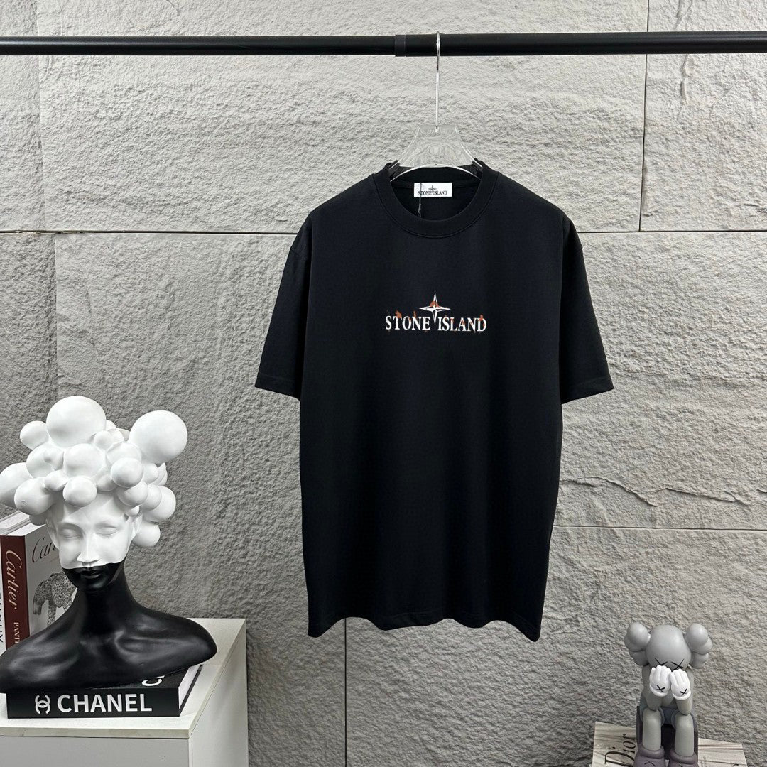 Stone Island Spring–Summer 2026 T-Shirt - Flame-Tipped Compass Star at Chest, Distressed Oversized Badge at Back