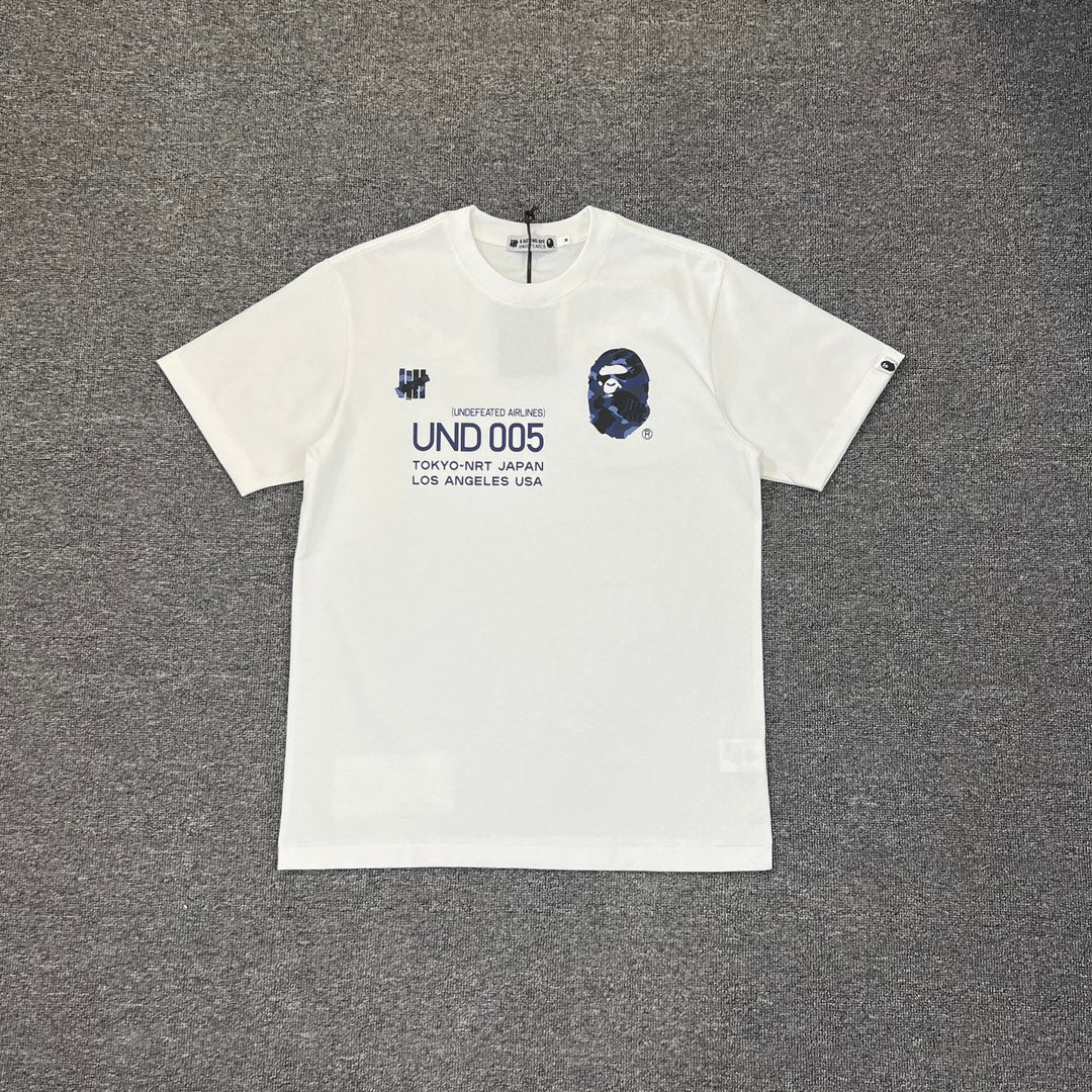 UNDEFEATED × BAPE Airlines UND 005 Tokyo–LA Camo Tee Oversized Unisex T-Shirt