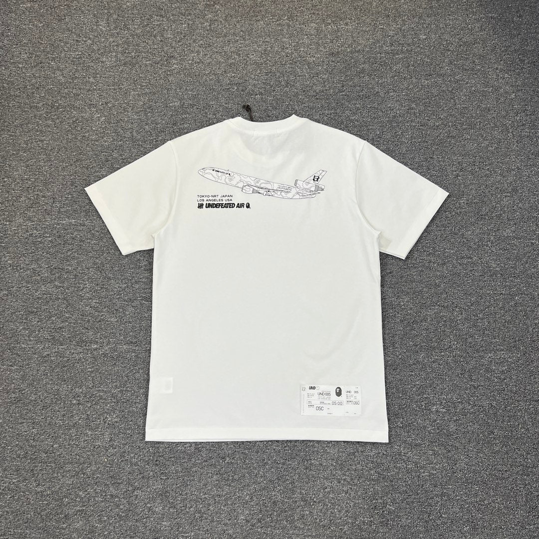 UNDEFEATED × BAPE Airlines UND 005 Tokyo–LA Camo Tee Oversized Unisex T-Shirt