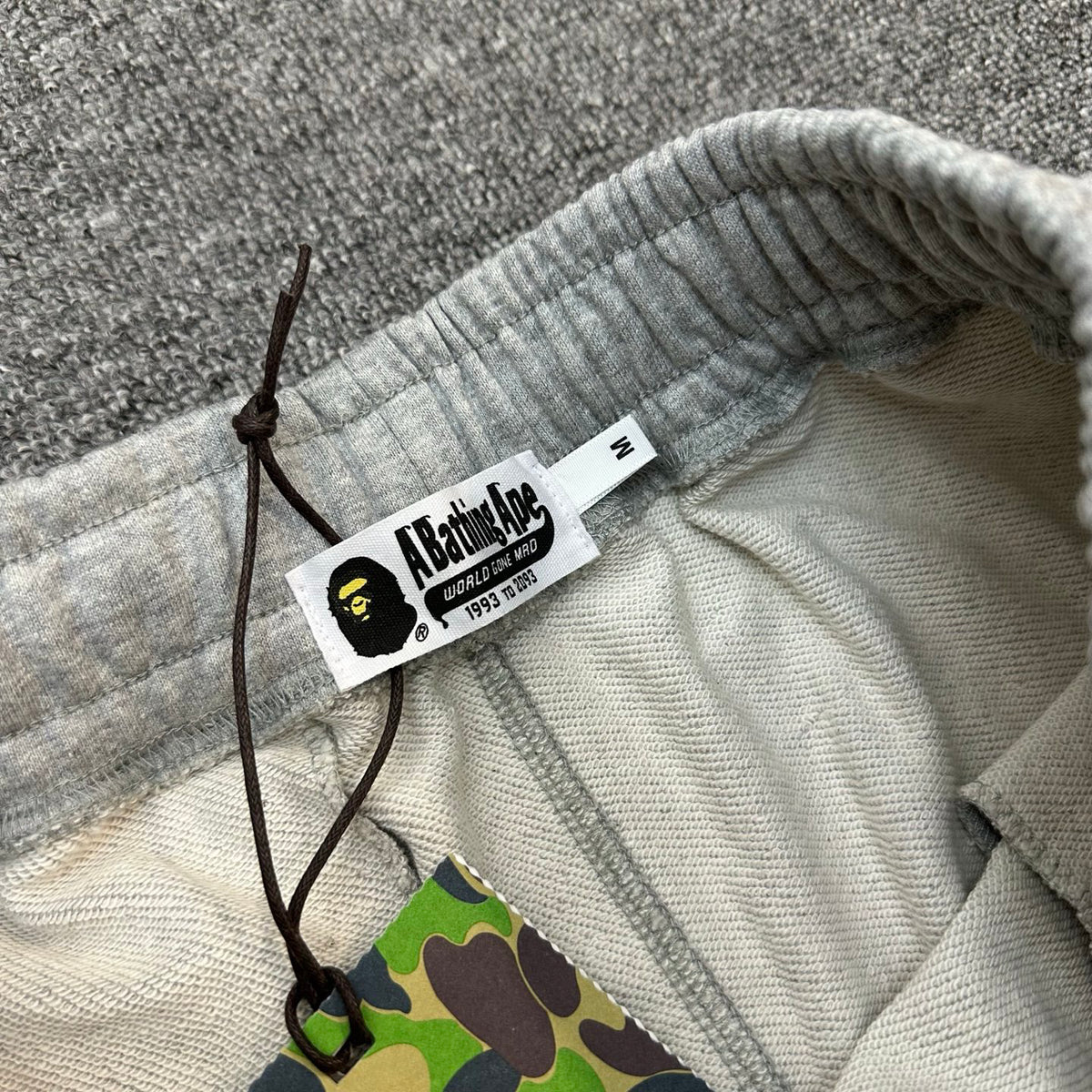 A Bathing Ape Wordmark Embroidered Raw Hem Shorts - Black / Gray
