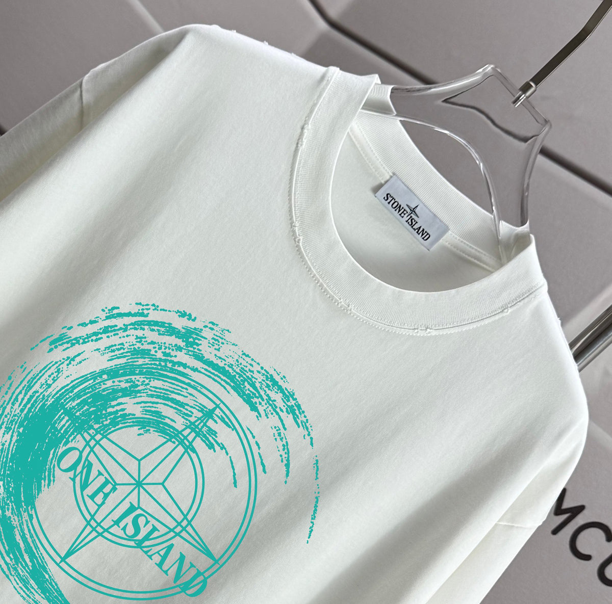 Stone Island Spring–Summer 2026 T-Shirt — 320gsm Washed Distressed Cotton, Teal Swirl Brushstroke Compass Rose Print